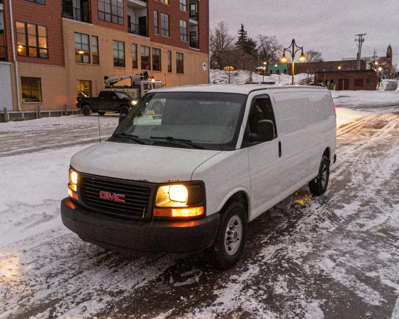 Service van at a commercial site at dusk